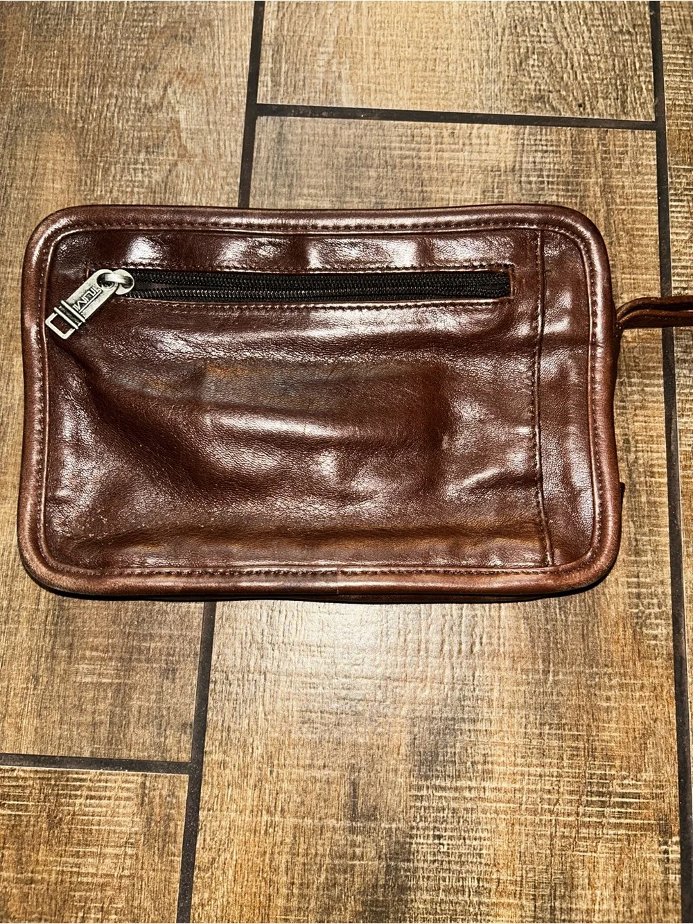 TUMI brown leather travel bag